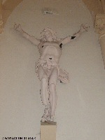The war-scarred Christ in Neuve Chapelle Church