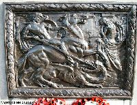 The central brass panel of the Tyneside Memorial seat