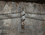 Wires run along the walls of the corridors