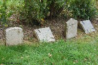Several different designs can be seen at the rear of the cemetery