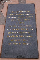 Plaque on the wall by the entrance