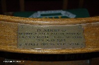 Brass plaque on chair in memory of Captain Bowlby