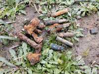 Bullets and other battle debris near Neuve Chapelle Farm Cemetery